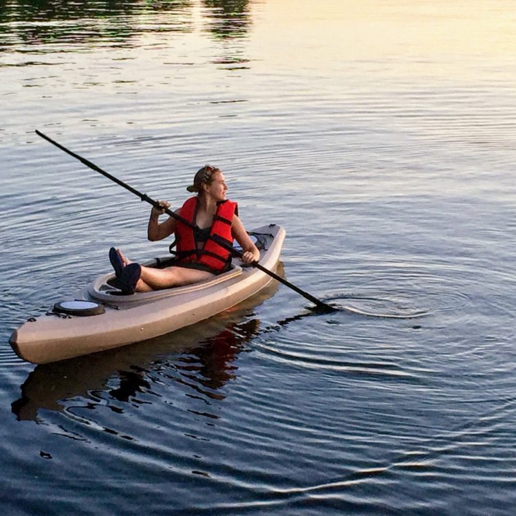 Young Lady on Lake Michigan on her Kayak