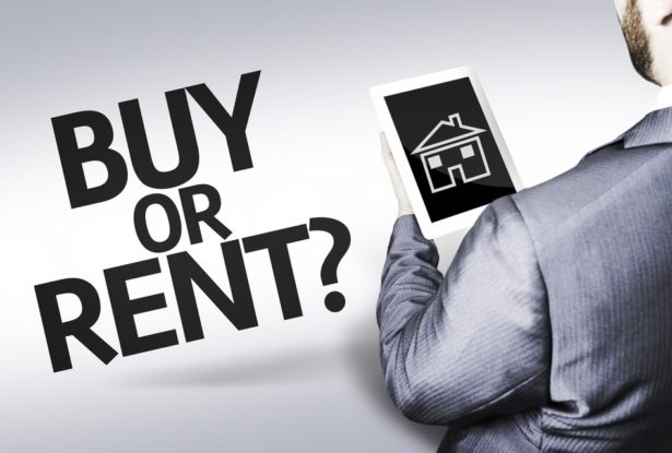 Man holding a tablet with a house on it with text that says buy or rent?