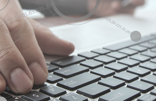 Person typing on keyboard