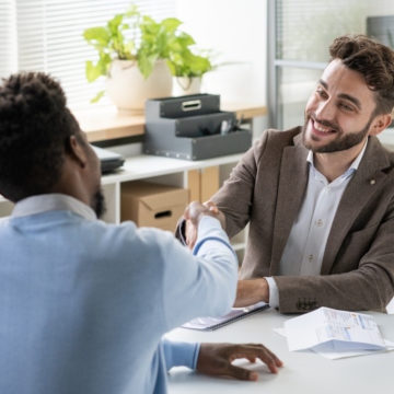 Smiling Banking Specialist Meeting With Couple