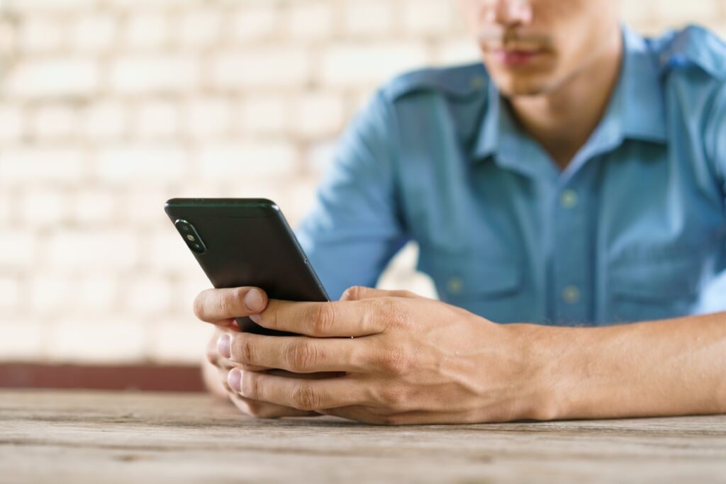 Man texting online banking