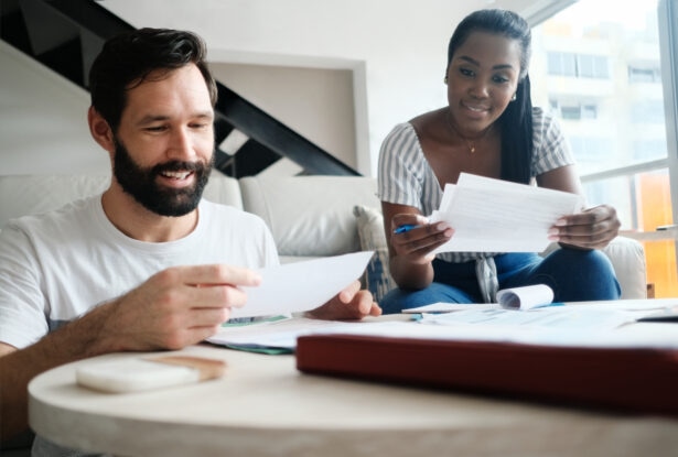 Couple Checking Bills for Home Budget and Tax